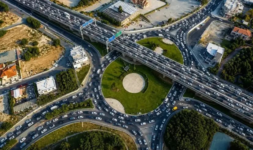 Peak-hour traffic on a multi-lane road in Limassol, queue of cars stretching toward the horizon