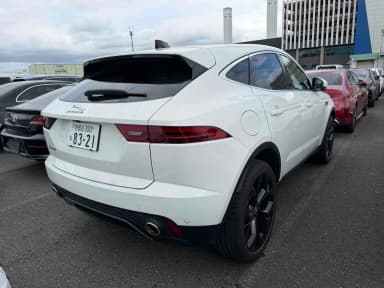 Rear three-quarter view of the Fuji White E-Pace with gloss black wheels. Car 107