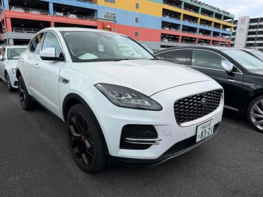 Front three-quarter view of a 2024 Jaguar E-Pace S P200 in Fuji White with black wheels. Car 107