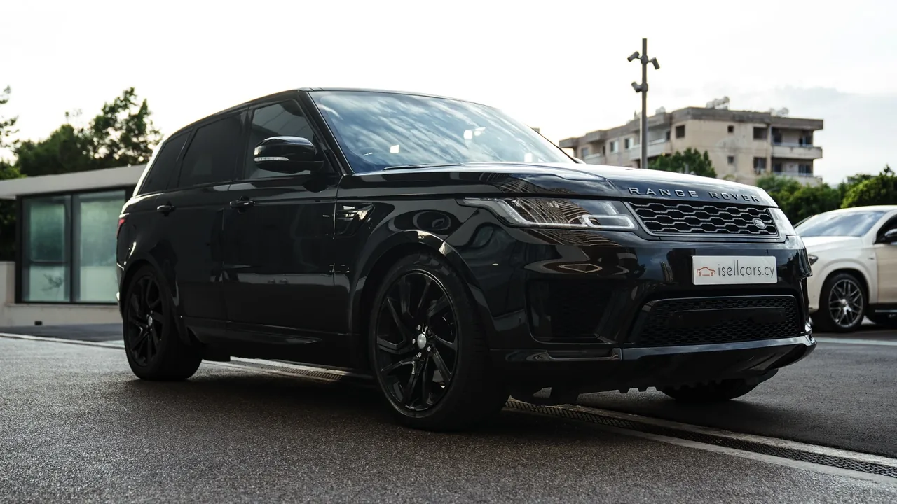 Front three-quarter view on a Limassol street, gloss black alloy wheels. Car 95