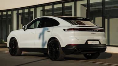 Front three-quarter opposite side, Carrara White Metallic. Car 79
