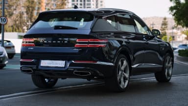 Rear three-quarter opposite side, coupe-like roofline. Car 80