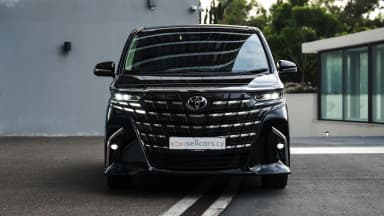 Front view with the large grille and LED headlights. Car 97