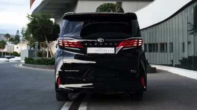 Rear view with the full-width LED light bar and tailgate badges. Car 97