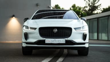 Front exterior view highlighting the grille and LED headlamps. Car 85