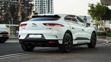 Rear three-quarter exterior view in evening light. Car 85