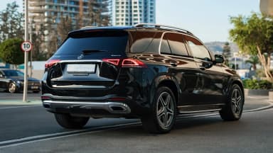 Rear three-quarter exterior view on a city street. Car 86