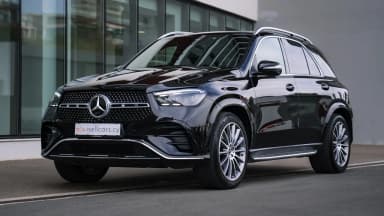 Black SUV, front three-quarter exterior view. Car 75