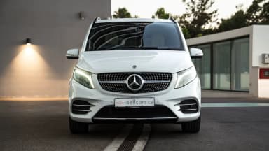 Front exterior view highlighting the chrome grille and LED headlamps. Car 84