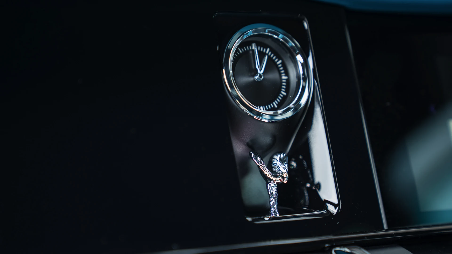 Dashboard clock detail with Spirit of Ecstasy motif. Car 83