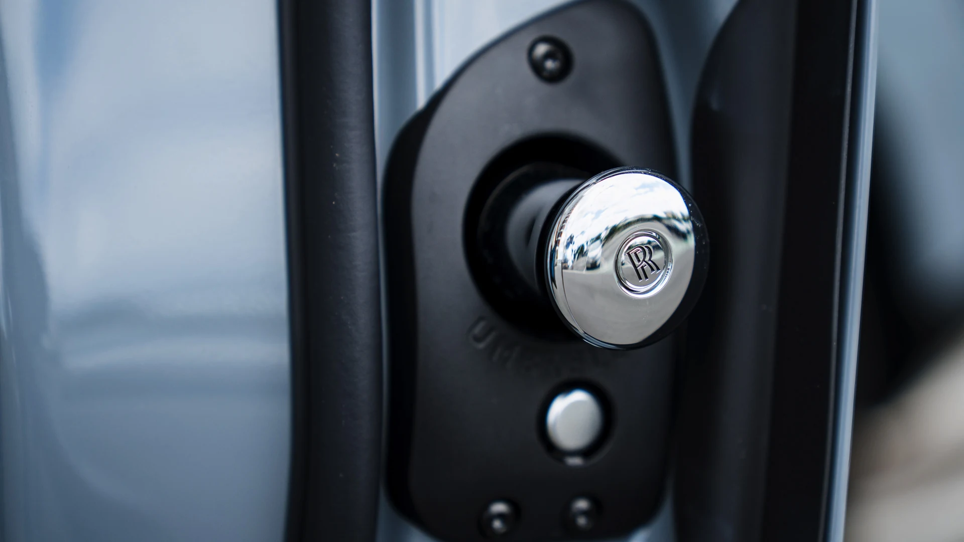 Door detail, chrome umbrella release and lock pin. Car 83