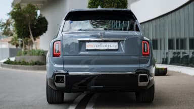 Rear view, vertical tail lights and isellcars.cy plate. Car 83