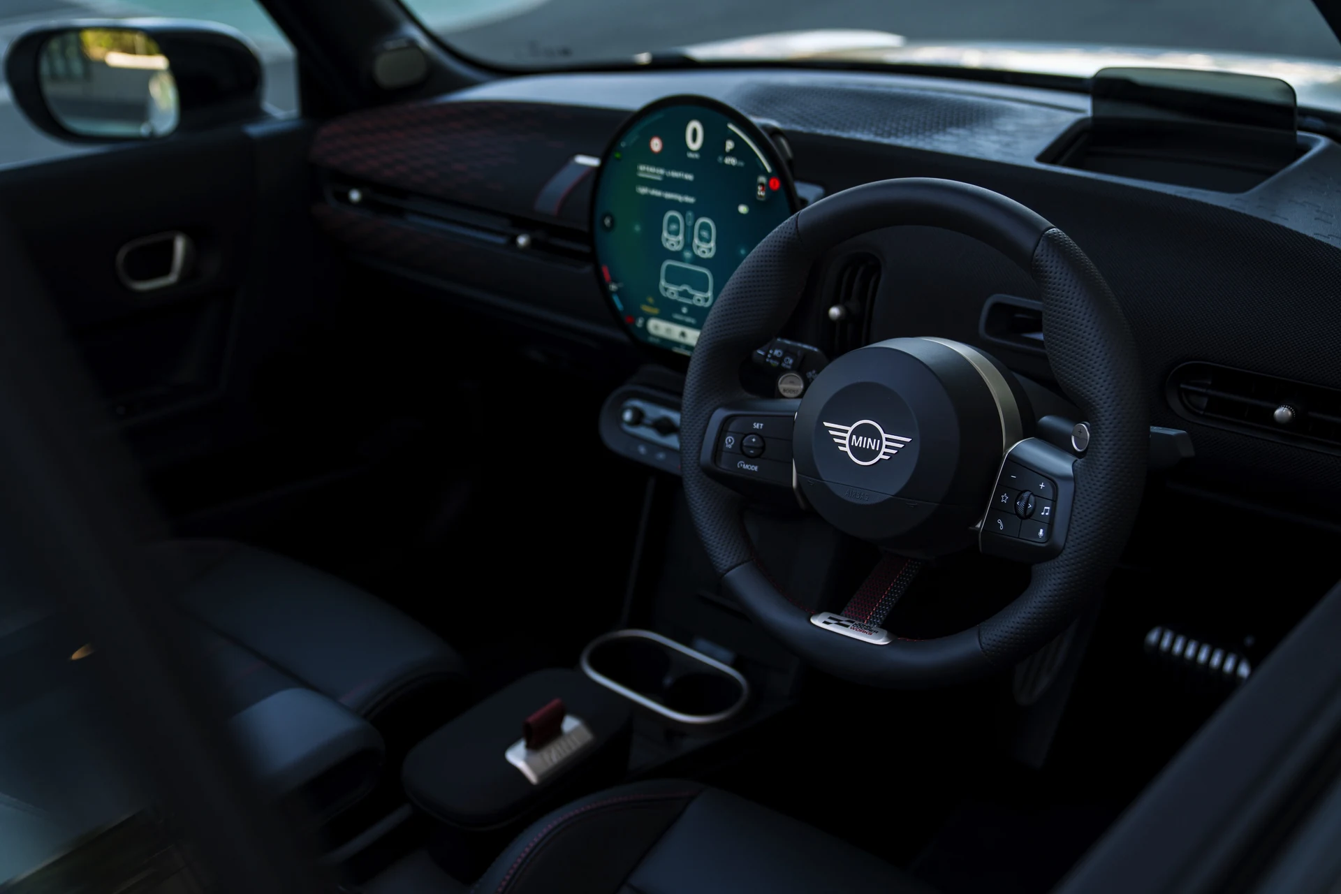 Steering wheel closeup, JCW leather wheel and paddle shifters. Car 81