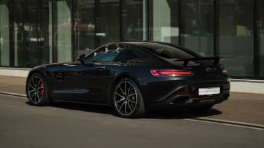 Rear three-quarter exterior view. Car 77