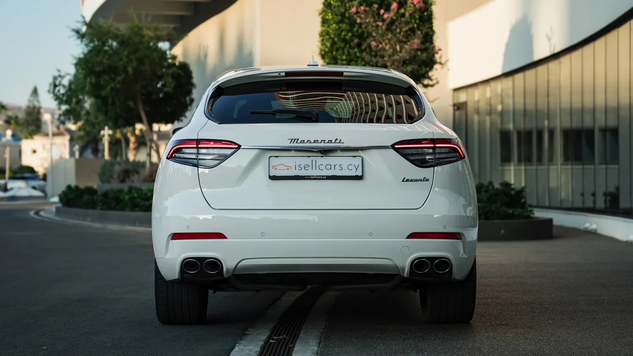 Rear view showing the tail lights and tailgate. Car 93