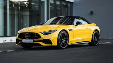 Front three-quarter view with the Panamericana grille and top down. Car 91