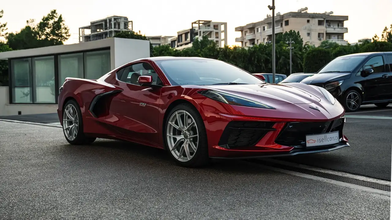Front three-quarter view showing mid-engine proportions and front splitter. Car 94