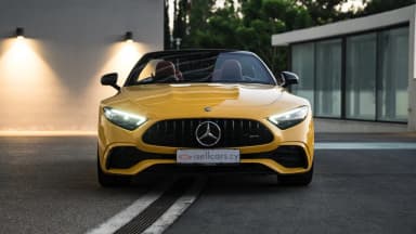 Front view with headlamps illuminated in evening light. Car 91