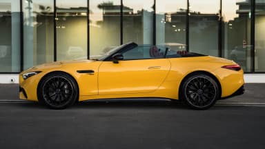 Full side profile of the roadster with the top down. Car 91