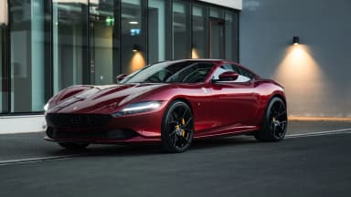 Front three-quarter view of a 2021 Ferrari Roma in Rosso Fiorano in Cyprus. Car 92