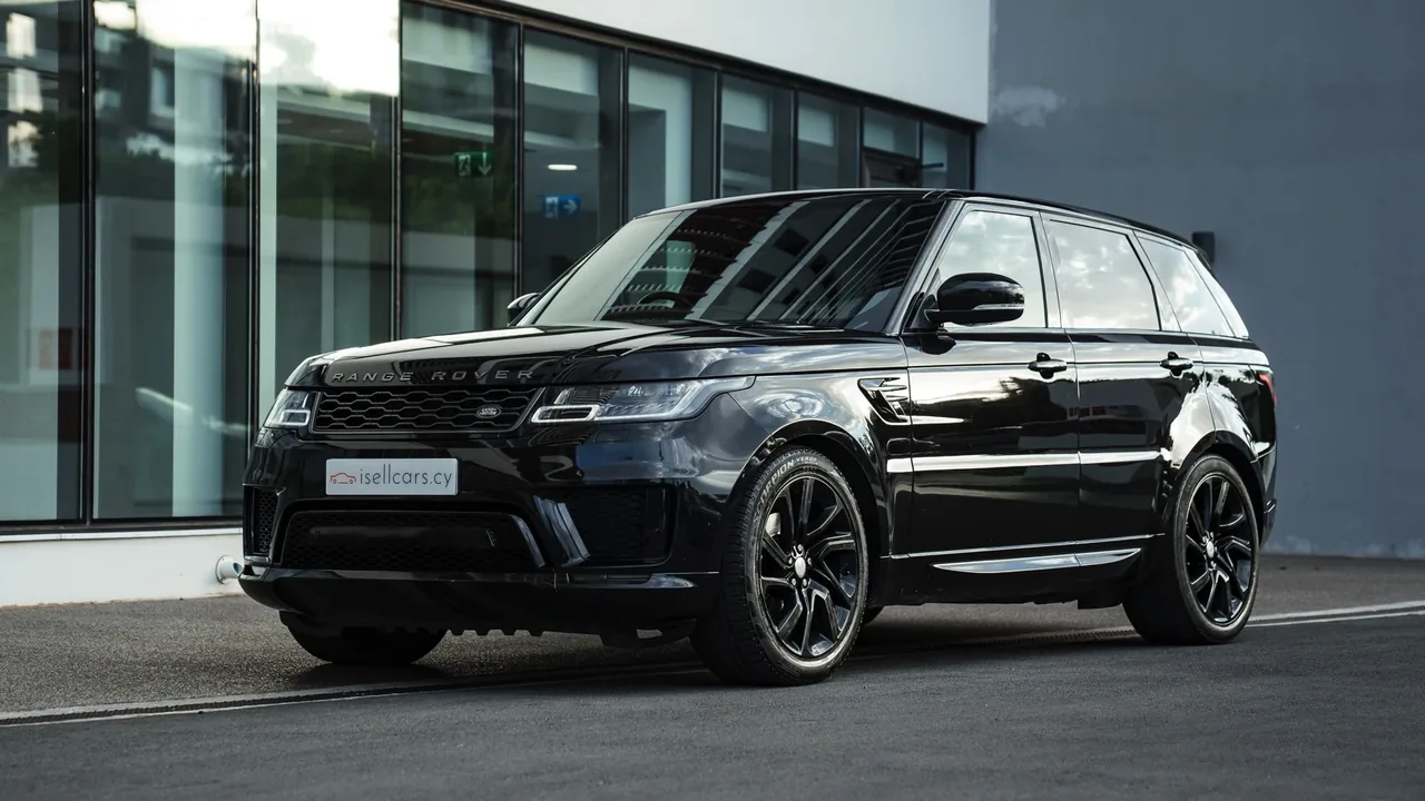 Black 2019 Land Rover Range Rover Sport HSE Dynamic, front three-quarter view outside the showroom. Car 95